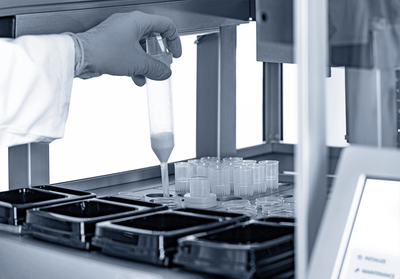 A robotic liquid handler pipetting samples