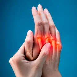 Two hands with the knuckle joints highlighted in red to suggest pain/inflammation. 