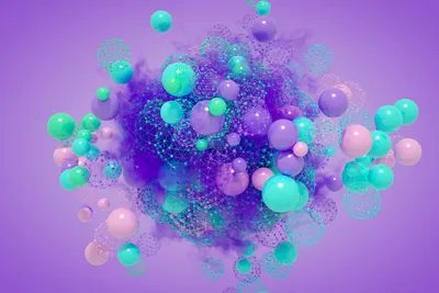 A rendering of multicolored, abstract spheres assembling into a molecular structure, representing 3D cellular assembly.