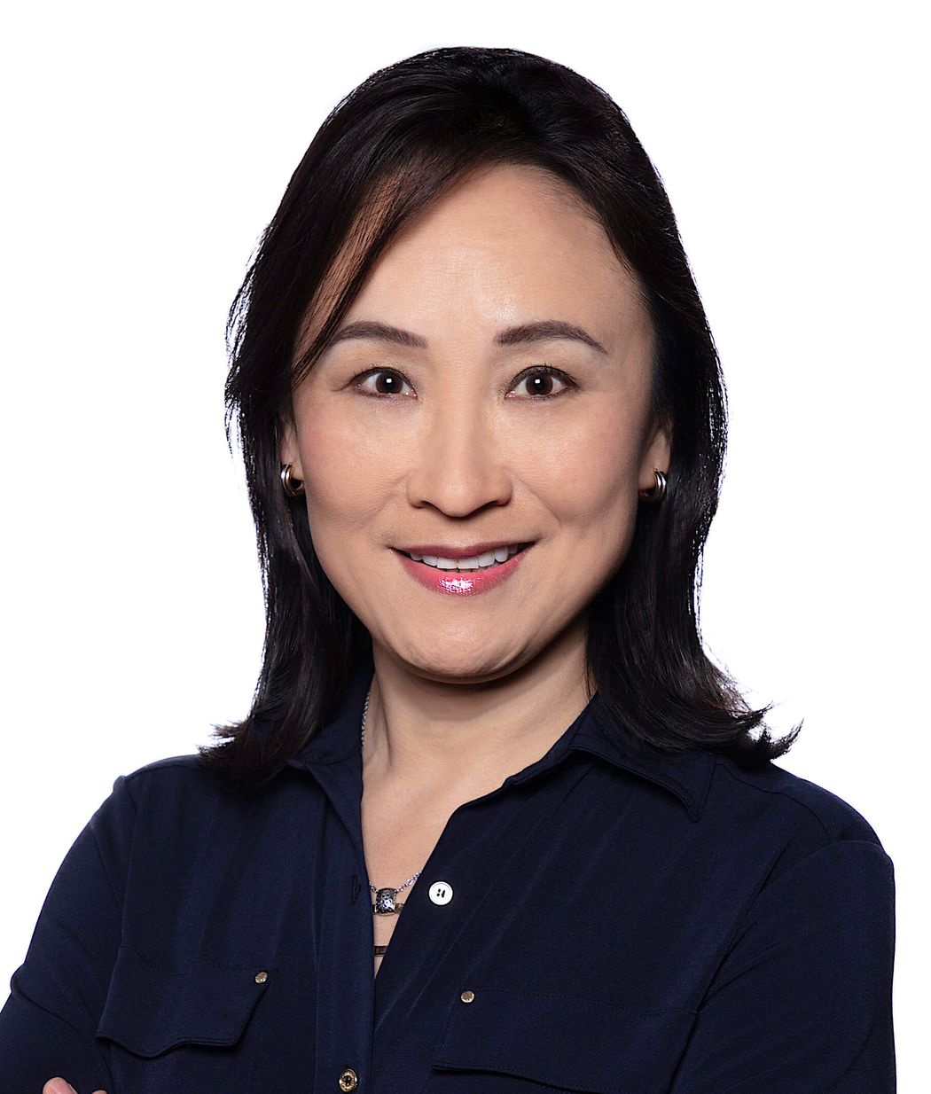 Joyce Teng wears a dark-colored shirt in a headshot.