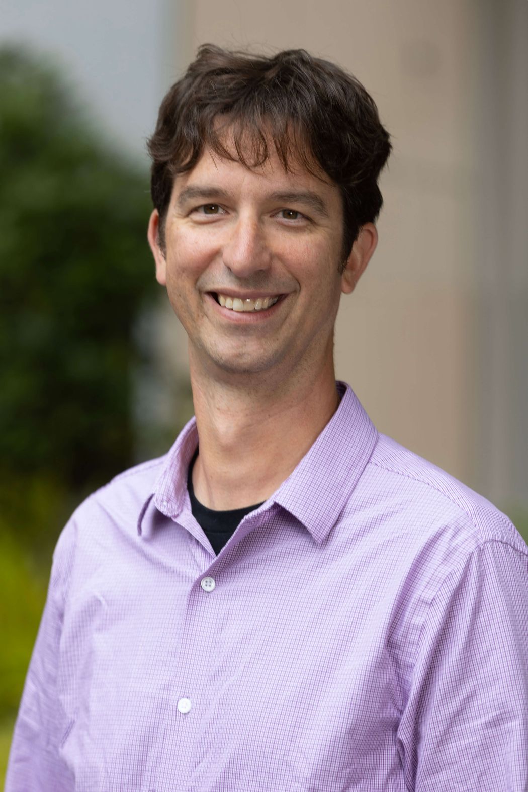 Peter Turnbaugh smiles in a photo outside.
