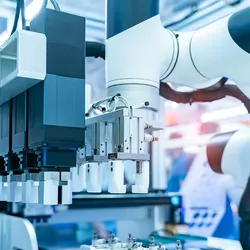 Close-up view of an advanced automated laboratory system with robotic arms and precision pipetting machinery, illustrating high-throughput lab automation and intelligent analytical technology.