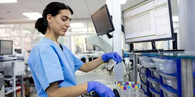 Female hematologist analyzing medical samples at a hospital laboratory