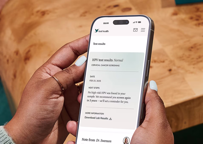A person holds a mobile phone with the results of the at-home HPV test showing. A person holds a mobile phone with the results of the at-home HPV test showing.