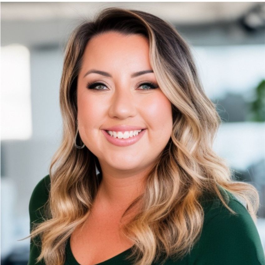 Eleonora Juarez wearing a green top in a modern office setting.
