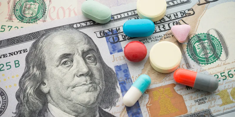 American dollars with pills over them
