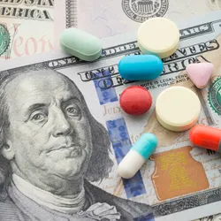 American dollars with pills over them