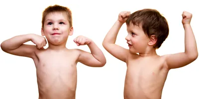 Two little boys show off their muscles 
