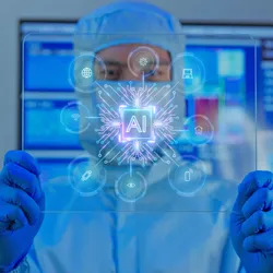 A man in protective overalls holding transparent tablet displaying AI chip technology innovation digital circuit 