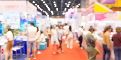 Abstract blurred trade fair exhibition with people