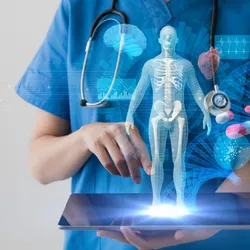A medical person holding a tablet with a holographic display of a human body and medication. 