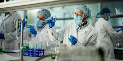 Group of researchers testing PFAS while working in laboratory.