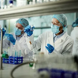 Group of researchers testing PFAS while working in laboratory.