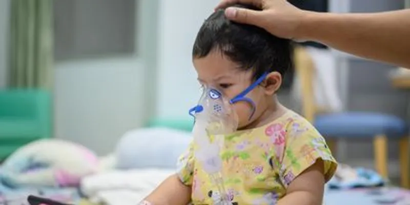 Young patient receiving respiratory therapy with a nebulizer
