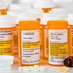 Bottles labeled with opioid medications related to pain management