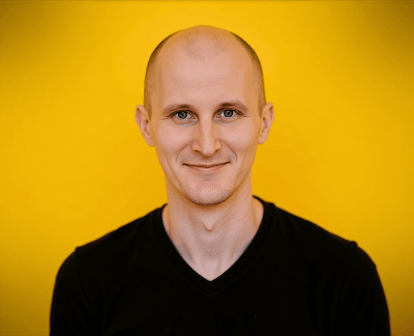 Portrait of a smiling man against a bright yellow background Portrait of a smiling man against a bright yellow background
