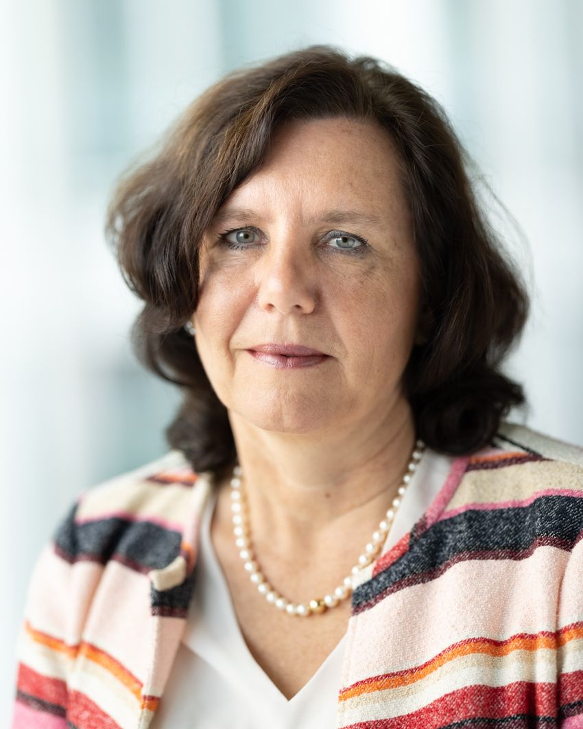 Angelika Jahreis wears a striped sweater on a white background.