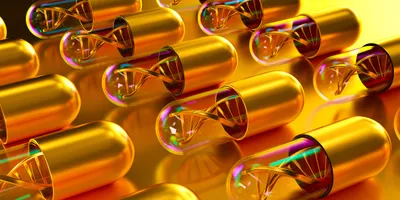 A conceptual 3D render of golden and transparent capsules, each containing a DNA helix, on a reflective golden surface.