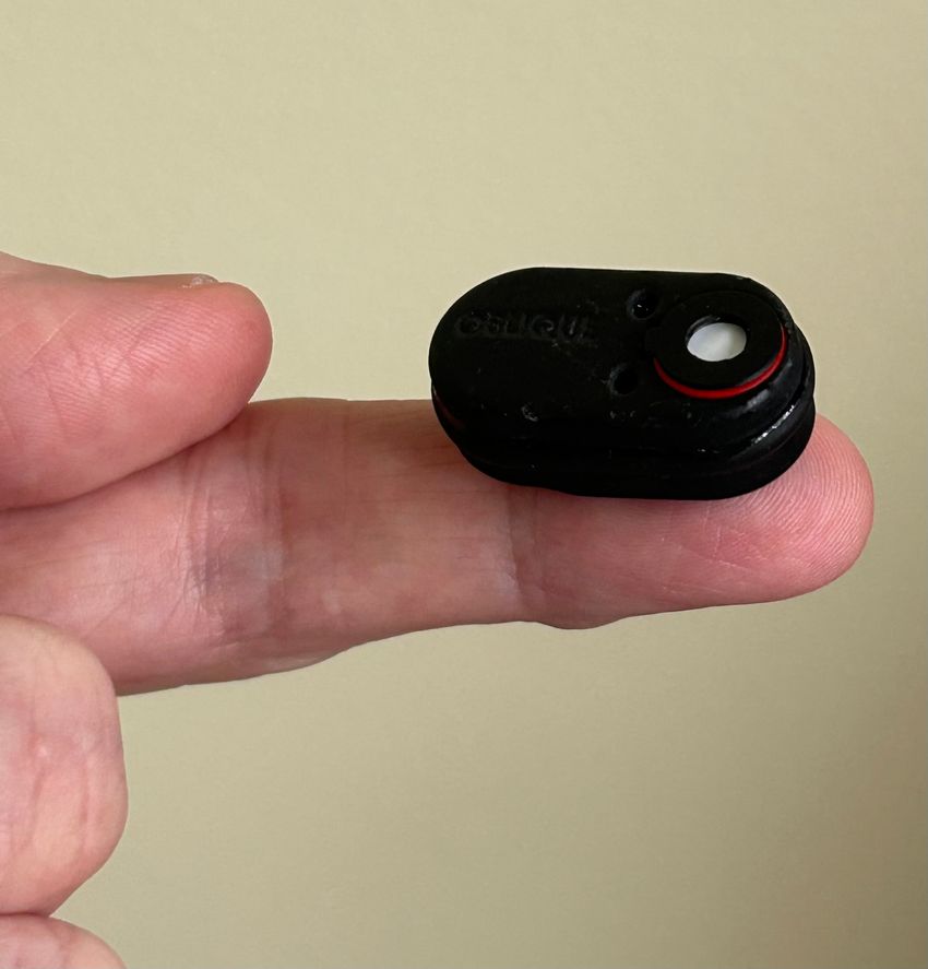 The biosensor system is balanced on a fingertip