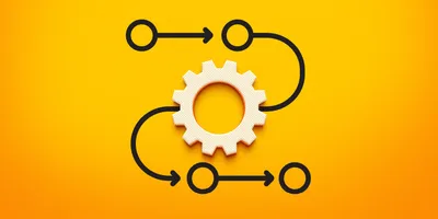 A 3D rendering of a process diagram featuring a central gear icon surrounded by a series of connected circles, each linked by arrows to represent a sequential flow.