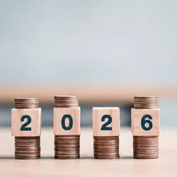 2026 stacked coins and wooden blocks