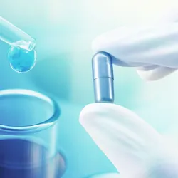 Photo of laboratory research on medicine with scientific equipment and chemical glassware representing scientific discovery and medical research