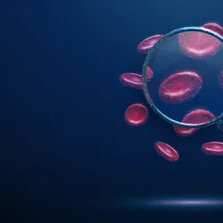 Magnifying glass with red blood cells inside.