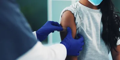 Girl getting vaccinated.