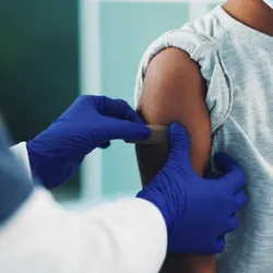 Girl getting vaccinated.