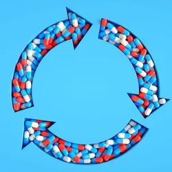 Three arrows in a circle filled with white red and blue pills on a light blue background.