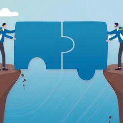 Two people holding puzzle pieces on opposite ends 