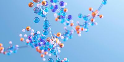 Illustration of a molecular structure composed of interconnected blue, orange, and white spheres against a light blue background, representing biomolecules or protein chemistry.