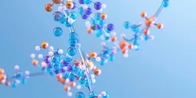 Illustration of a molecular structure consisting of interconnected blue, orange and white spheres on a light blue background. Represents biomolecule or protein chemistry.