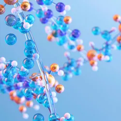 Illustration of a molecular structure composed of interconnected blue, orange, and white spheres against a light blue background, representing biomolecules or protein chemistry.