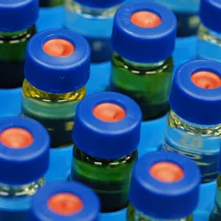 Mass spectrometry bottles are shown in blue and orange.