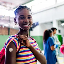 Portrait of a teenager student after taking vaccine at school