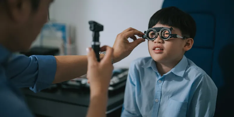 Young boy getting his eyes tested.