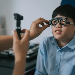Young boy getting his eyes tested.