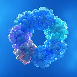 3D illustration of a protein complex composed of clustered spherical subunits arranged in a ring-like oligomeric structure, shown in shades of blue, cyan, and purple against a blue gradient background.