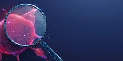 Digital illustration of a magnifying glass enlarging a red tumor composed of clustered cells.