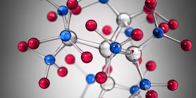A 3D molecular model showing interconnected red, blue, and silver atoms against a gray background. 