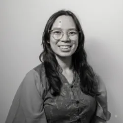 black and white picture of sharon dong in button up blouse