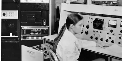 A woman sitting in front of mass spectrometer 