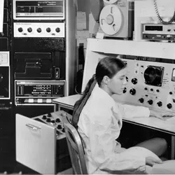 A woman sitting in front of mass spectrometer 