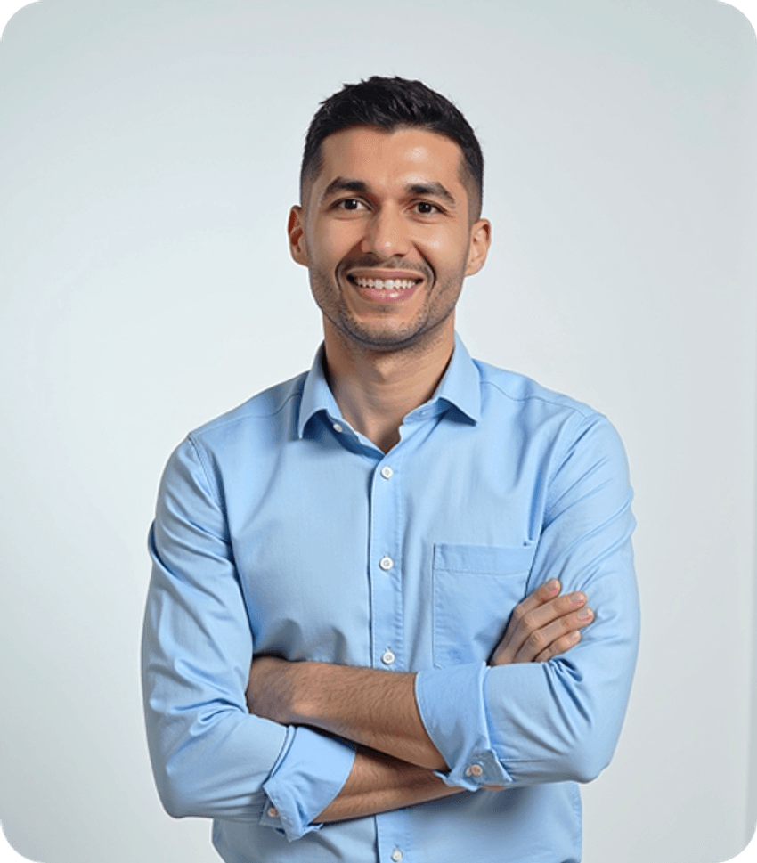 A headshot of Riad Gacem, wearing a blue shirt.