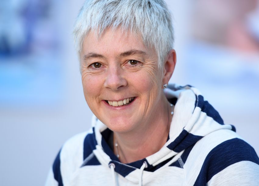 Sartorius BioAnalytics Application Development Manager and cellular pharmacologist Nicola Bevan, pictured smiling in a blue and white striped hoodie with short grey hair, leads R&D for Incucyte® live-cell analysis and iQue® HTS cytometer applications.