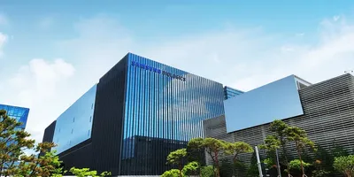 Exterior view of the Samsung Biologics campus building in Songdo, South Korea, headquarters of the CDMO's global biomanufacturing network.