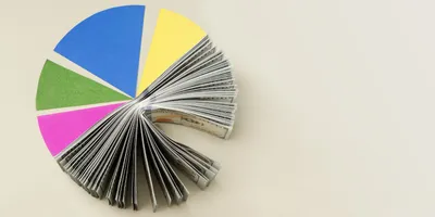 A 2D Pie chart, with half of it represented as a wad of cash. 