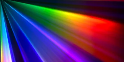 Abstract rainbow-colored beams of light spreading across a dark background.