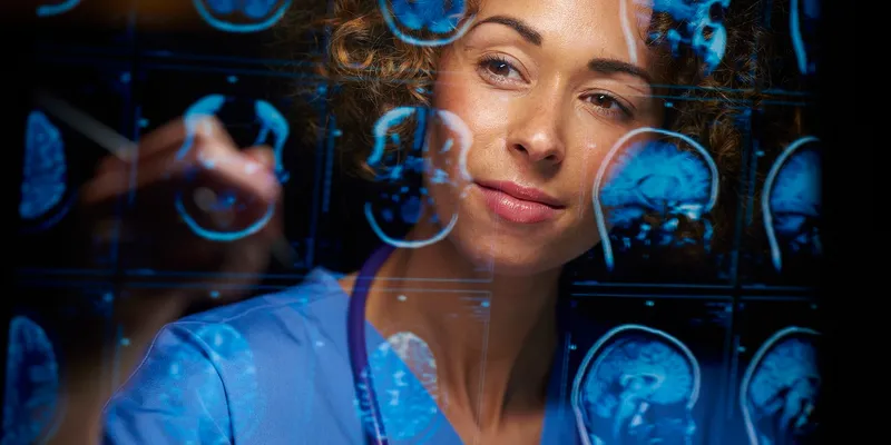 A female doctor analyzing brain scans.